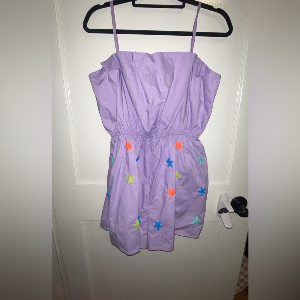 NWOT only tried on. Won’t fit my chest.  Super cute purple with sparkly stars.